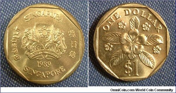 SINGAPORE 1989  $1 ORCHID COIN.
Currently in circulation. This piece is AUNC. Flawless showpiece. Unused since 1989.
For sale. Please make an offer.