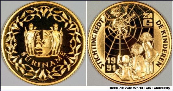Gold 250 guilders proof coin for the Save the Children Fund. The reverse shows a guitar playing spider character watched by three children, with the Dutch inscription STICHTING REDT DE KINDEREN