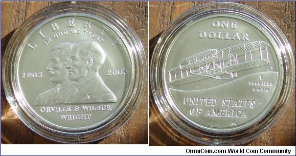 2003 First Flight Commemorative Uncirculated Silver Dollar
Mint Philadelphia
Weight 26.73 Grams
Diameter 38.10mm
Composition 90% Silver 10% Copper