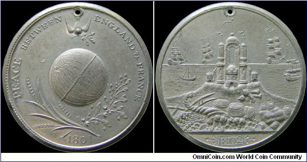 Peace of Amiens, Great Britain.

A RRR white metal medal. It was manufactured to be holed for wear.                                                                                                                                                                                                                                                                                                                                                                                                               