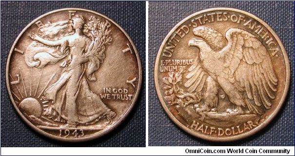 1943 Walking Liberty Half Dollar (Face dark toned, Rev slight rainbowing.)