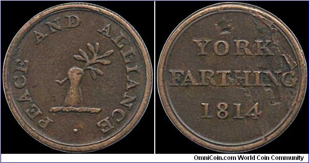 York farthing token.

There are some lamination flaws of the reverse of this tiny coin. As usual the regal coinage had pretty much disappeared by 1814 and merchants were once again producing tokens. This one dates just after Napoleon's first abdication.                                                                                                                                                                                                                                                     