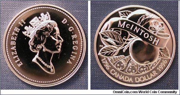 1996 Canada Silver Dollar, 200th Anniversary of John McIntosh.  Paying tribute to Canada's most important commercial apple. Mintage 58,834. .925 Silver, 25.17g, 36mm, Reeded edge.