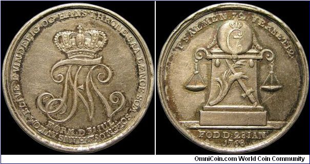 Marriage jeton.

Commemorating the wedding of Frederik VI to Marie Sophia Frederica of Hesse-Cassel.                                                                                                                                                                                                                                                                                                                                                                                                              
