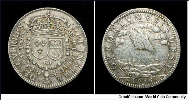 French Jeton, silver
Obv: Crown with crests of France and Navarre below. Monogram of Louis XIV. Double collar, ORDINAIRE DES GVERRES (the army accountants).
Rev: A celestial shield appearing from the clouds above the country side. OPPORTVNVS ADEST / 1656 (Opportune appearance).
