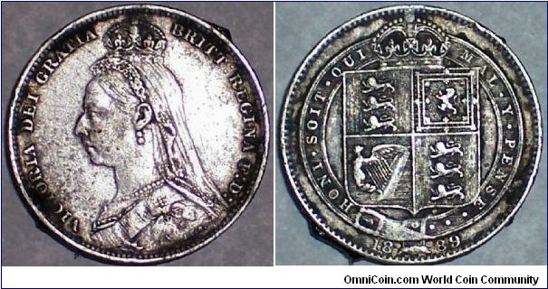 Large Bust shilling with rather unattractive toning.