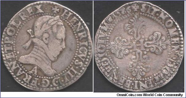 1586 `Franc Au Col Plat' of Henri III de France (Paris Mint). Bust obverse.  Croix feuille with `H' at centre on reverse.