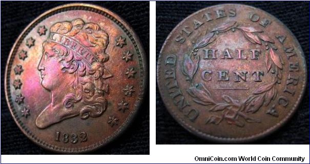 1832 half cent.  I don't want to know what caused her to blush that violent shade of fuschia.