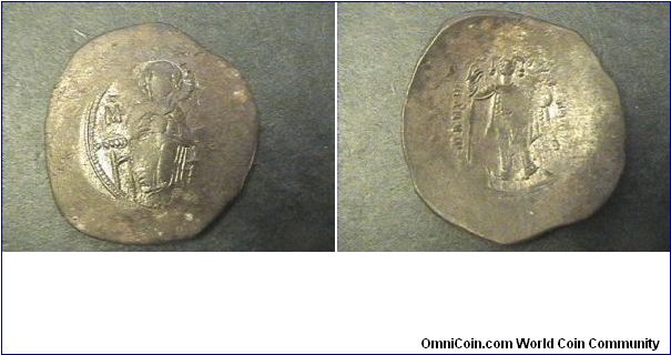 Byzantine Empire
Manuel I 1143-1180
Billon trachy.
Obv: virgin enthroned facing MP-OV
Rev: Manuel standing. 

30mm 2.9 grams