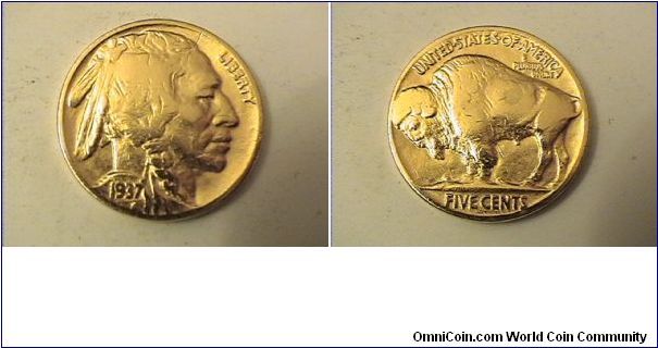Gold Plated 1937 Buffalo nickel.

I have no idea why someone gold plated this