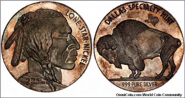 Two ounce silver bullion round with designs similar to the buffalo nickel and the new gold buffalo.