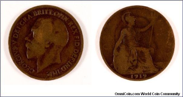 A 1919 Penny, heavily worn. Notice how you can see the outlines of the portrait on the reverse. One can barely see the letters O and NNY (where it should read ONE PENNY). On the picture only the O is recognisable.
All though (or maybe because it is) worn, I consider it beautiful.

The portrait outline was known as ghosting and it was the reason for the stop in penny production between 1923 and 1925 and the modification of the alloy from then on.