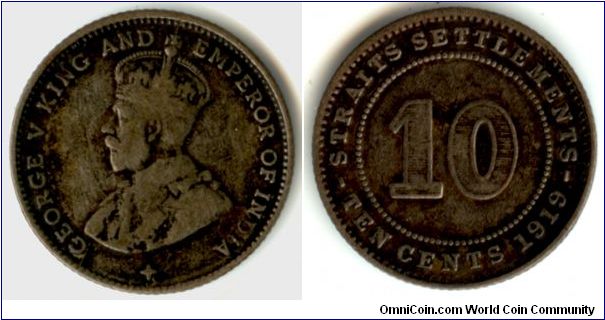 A Straits Settlements 10 cent silver coin. The diameter of this coin is around 18 cm.