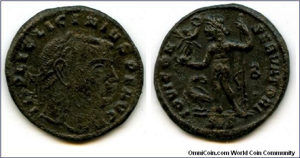 Licinius I, 308-324 AD
Follis 313-315 
Obv Laureate head right. IMP LIC LICINIVS P F AVG 
Rev Jupiter facing, head left, holding sceptre and victory with wreath on globe. Eagle holding wreath stands to the left.
B in right field. IOVI CON-SERVATORI 
Exergue: SIS 
20 x 21mm, 3.21g.
Siscia mint Officina 2