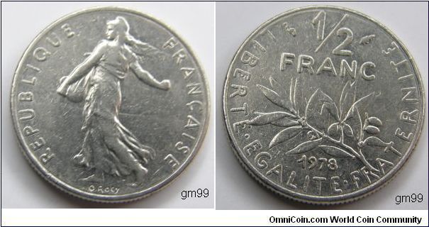 Nickel 1/2 Franc (1978)
Obverse- Liberty walking left, sun with rays on right in background 
REPUBLIQUE FRANCAISE 
Reverse- Stalk below value 
LIBERTE EGALITE FRATERNITE 1/2 FRANC 1978