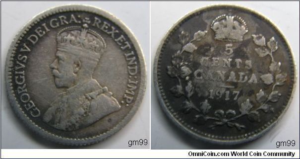 5 Cents (Silver) : 1912-1919
Obverse; Crowned head of King George V left,
GEORGIVS V DEI GRA REX ET IND IMP
Reverse; Legend within wreath, crown above,
5 CENTS CANADA, date 1917