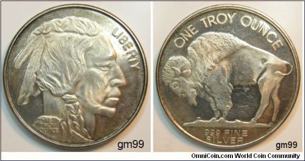 Indian Head on Obverse side, Buffalo on Reverse,
This is very shiny  (mirror). Has a little toning. 
 One troy Ounce,.999 Fine Silver