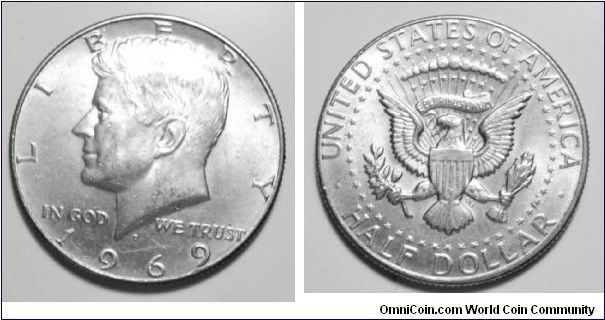 Obverse Image: John F. Kennedy, 35th President of the United States. 
Reverse Image: Eagle holding an olive branch (peace) and arrows (strength). The thirteen stripes represent the 13 colonies. The horizontal bar across the top represents Congress forming one government from many. Fifty stars representing the fifty states encircle the eagle. [ ? ] 
Metal Composition: 40% silver, 60% copper 
Total Weight: 11.5 grams