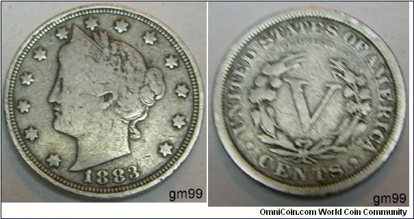 Liberty V Nickel
5 Cents, Metal content:
Copper - 75%
Nickel - 25%
Weight: 5 grams
Edge: Plain
Mintmark: None (for Philadelphia) on the reverse below the button to the left of CENTS