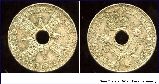 New Guinea
1936
1/- One Shilling
Native symbols
Crown over crossed septers