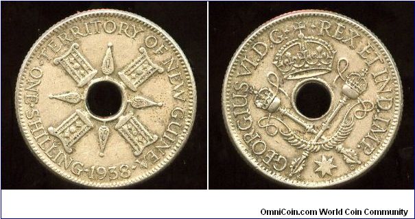 New Guinea
1938
1/- One Shilling
Native symbols
Crown over crossed septers