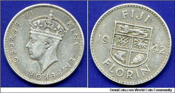 1 florin.
George VI (1936-1952).
Titles King & Emperor - of a portrait.
'S'- San-Francisco mint.
Mintage 250,000 units.

Ag900f. 11,31gr.