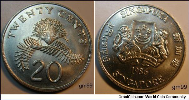 Very Shiny. Picks up other colors around it.
20 Cents
Obverse:
Value, Calliandra surinamensis
Reverse:Coat of Arms,