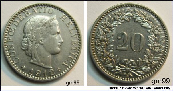 20 Rappen (Nickel) Obverse; Head of Helvetia right, LIBERTAS on headband,
CONFOEDERATIO HELVETICA date 1912
Reverse; Value within wreath
 20