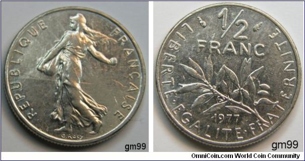 1/2 Franc (Nickel) Obverse; Liberty walking left, sun with rays on right in background,
REPUBLIQUE FRANCAISE
Reverse; Stalk below value,
LIBERTE EGALITE FRATERNITE 1/2 FRANC date 1977