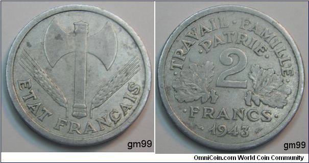 2 Francs (Aluminum) : 1943-1944
Obverse: Double-headed axe with wheat stalk either side, mintmark B to left of axe blade,
ETAT FRANCAIS
Reverse: 2 between two leaves,
TRAVAIL FAMILIE PATRIE 2 FRANCS date 1943
