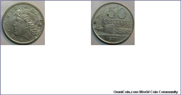 Obverse: Head of Liberty, left Brazil
Reverse: Ship at dock with bow to right, being loaded by crane, 50 Centavos
Stainless Steel