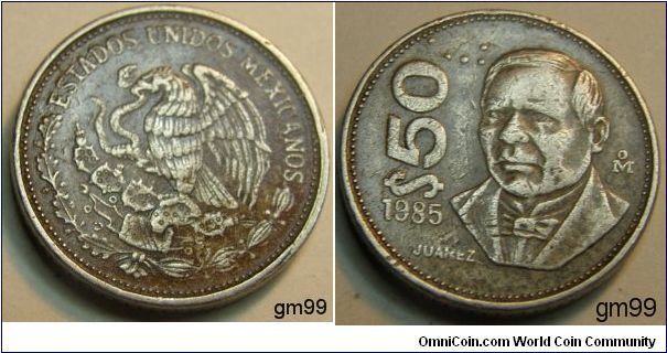50 Pesos (Copper-Nickel) 
Obverse: Eagle standing left on cactus, snake in beak,
ESTADOS UNIDOS MEXICANOS
Reverse: Benito Juarez facing,
$50 date 1985 JUAREZ