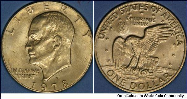 Eisenhower Dollar, same size as the silver dollars of half a century before but now Cu-Ni.  The reverse commemorates landing on the moon 'the eagle has landed'.  38 mm, Denver mintmark