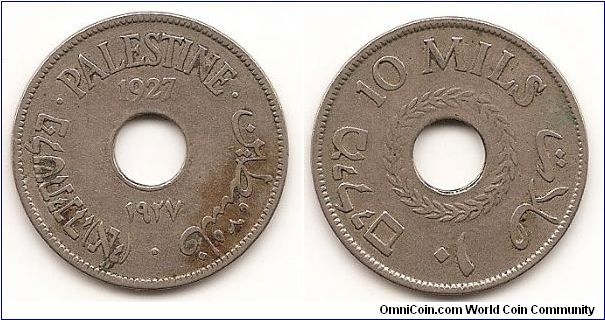 10 Mils
KM#4
Copper-Nickel Obv: Date above and below center hole Rev:
Wreath around center hole with value above and below