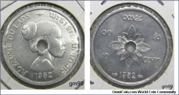 Laos issued its first coins in 1952, when it was gaining independence from France.  The coins were issued by the Kingdom of Laos and consisted of the 10, 20 and 50 Cents struck in aluminum at the Paris Mint. All three coins were struck with a center hole to allow for the coins to be easily strung and carried. It appears the hole was an afterthought in the design process as it pierces the center of the design, rather than incorporating the hole into an artistic design.