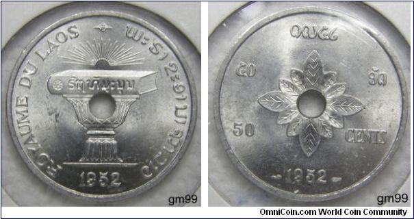 Laos issued its first coins in 1952, when it was gaining independence from France. The coins were issued by the Kingdom of Laos and consisted of the 10, 20 and 50 Cents struck in aluminum at the Paris Mint. All three coins were struck with a center hole to allow for the coins to be easily strung and carried. It appears the hole was an afterthought in the design process as it pierces the center of the design, rather than incorporating the hole into an artistic design.