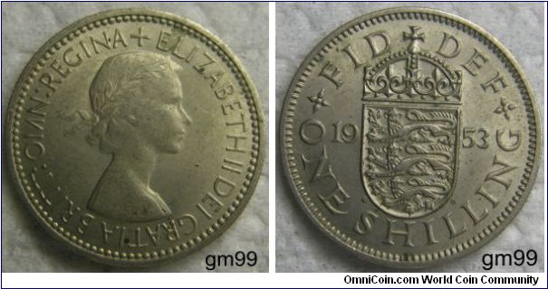 Shilling (1953)
OBVERSE:  Laureated head of Elizabeth II right 
+ELIZABETH II DEI GRATIA BRITT:OMN:REGINA 
REVERSE;  English arms, three lions on crowned shield 
FID DEF 1953 ONE SHILLING