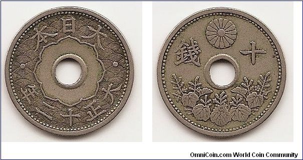 10 Sen-Yr.12-
Y#45
3.7500 g., Copper-Nickel, 22 mm. Ruler: Yoshihito (Taisho)
Obv: Flower-like form of sacred mirror around hole in center
flanked by dots with authority on top and date below Rev:
Chrysanthemum flanked by value above hole in center with
paulownia foliage on bottom 1/2