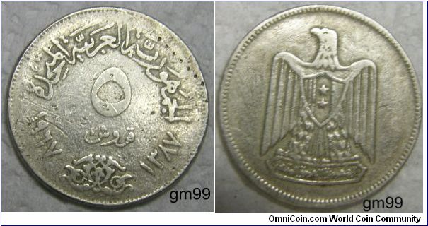 5 Piastres (Copper-Nickel) : 1967
Obverse: Arabic script around denomination, date in arabic in AD and AH form,
 Arabic script and dates around 5 and denomination
Reverse: Eagle standing facing, head looking to left, wo stars on shield on breast, arabic script below,
 No legend