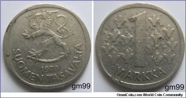 1 Markka (Copper-Nickel): 1969-1993
Obverse: Rampant lion left holding sword and standing on saber,
SUOMEN TASAVALTA date
Reverse: Leaves or Ys left and right of 1
R 1 MARKKA