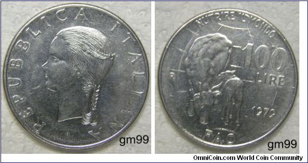 100 Lire (Stainless Steel) : 1979
Obverse: Head left with braided hair,
 REPVBBLICA ITALIANA
Reverse: Cow facing, nursing calf, globe with meridian lines in background,
 NUTRIRE IL MONDO 100 LIRE R 1979 FAO