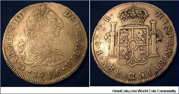 8 reale PTS (Potosi) Bolivia mint, Assayer P.R. 1786 Charles III carlos/carolus)(26.74g)This coin has an oversized 41mm planchet and is struck offcenter. There are also die clash letters beside the bottom of the right pillar on the reverse.