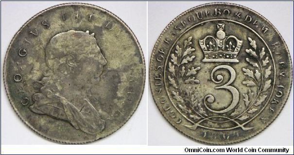 George III, Essequebo & Demerary, 3 Guilders, 1809. 23.3200 g, 0.8160 Silver, .6118 Oz. ASW. Obverse: Laureate, draped and cuirassed bust right, Georgivs III Dei Gratia. Reverse: Crowned, 3  within wreath, Colonies of Essequebo & Demarary Token, 1809 around. Crudely struck Fine/VF (Note: Very crudely struck as usual, VF for issue). Very Rare. This type is seriously undervalued in Krause.