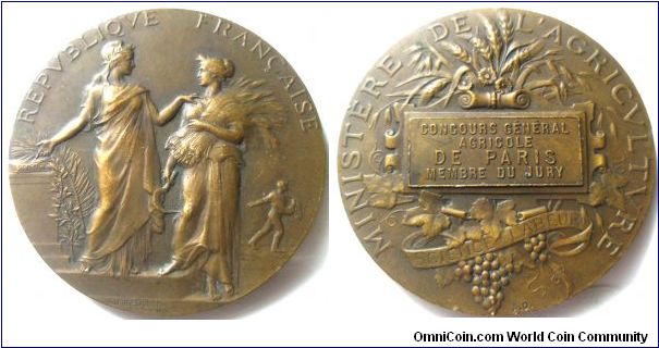 France, Minister of Agriculture, Agricultural associations prize medal, 1900, Obverse: Marianne & Ceres standing, Marianne points to Science book, a man sows seed in the background, REPVBLIQVE FRANCAISE around. Revrse: Corn , vine and grapes around central tablet with 'Concours General Agricole, De Paris, Member Du Jury' , and MINISTERE DE L'AGRICULTURE around. XF.