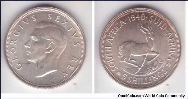 KM-31, 1948 South Africa 5 shillings or crown; one of the better specimens although some bagmarks are visible.