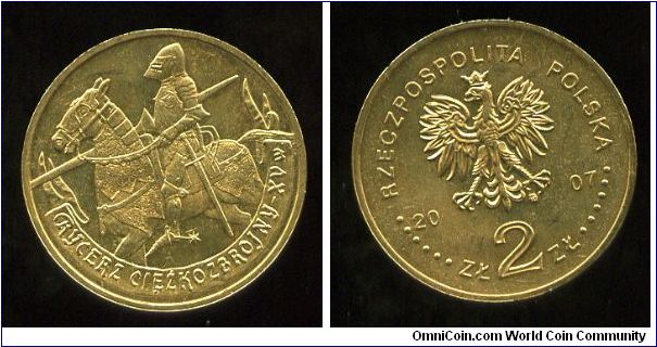 2 Zloty 
History of the Polish Cavalry  
15th century Mounted Knight
Image of a heavy armoured mounted
horseman with a lance. At the bottom on the sash
Eagle, value & date