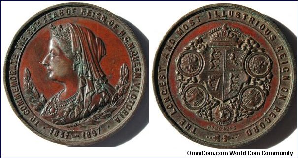 Queen Victoria Jubilee Medal.
TO COMMEMORATE THE 60th YEAR OF H.G.M. QUEEN VICTORIA 1837-1897.  Rev: THE LONGEST AND MOST ILLUSTRIOUS REIGN ON RECORD. Rd 284223. Patination deep red.  39mm Bronze