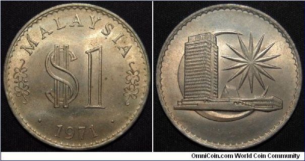 Copper-Nickel, 33.5mm Obv: Artistic value and dollar sign above date Rev: Parliament house within cresent, BANK NEGARA MALAYSIA. Mintage: 2,000,000.