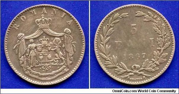 5 bani.
Duchy of Romania.
Prince Karol I (1866-1881).
Heaton Mint, Birmingham.


Cu.