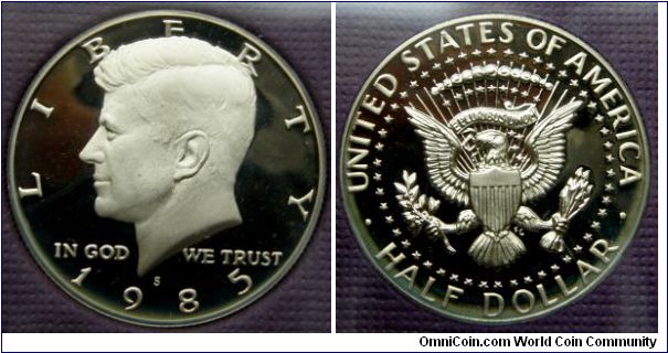 Kennedy Half Dollar. 1985S-Mintmark: S (for San Francisco, CA) centered above the date. Metal content:
Outer layers - 75% Copper, 25% Nickel
Center - 100% Copper. Proof Set.